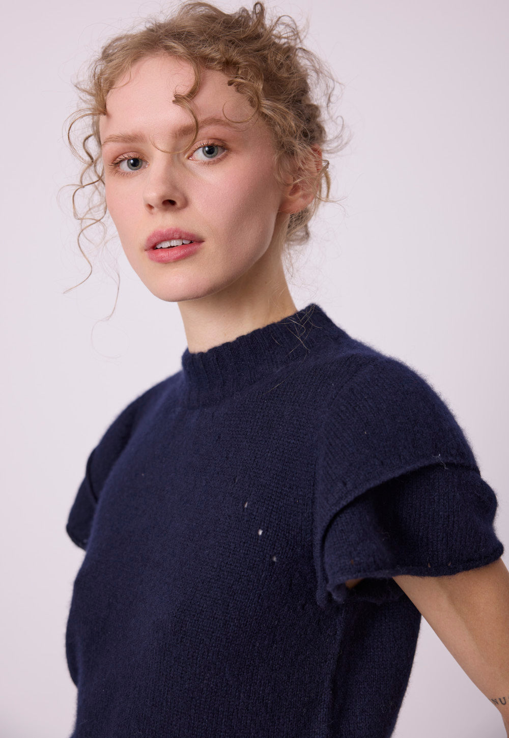 Antonia Zander Maika Top styled look, showing the fluffy cashmere-silk knit and statement double ruffle sleeves.