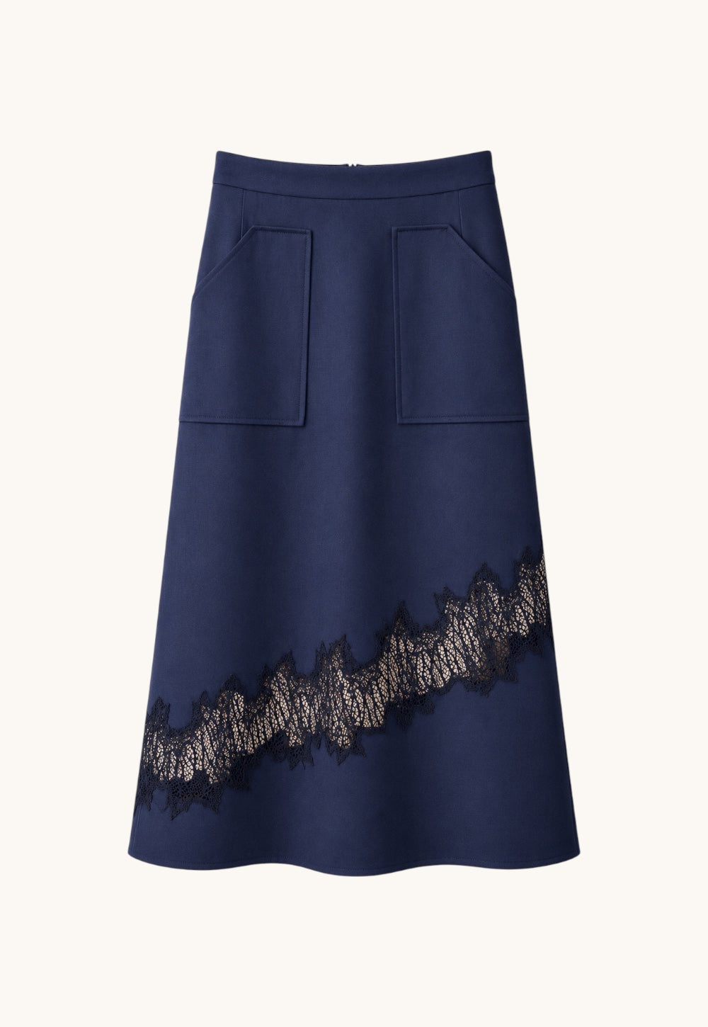 Front view of the Antonia Zander Romina Skirt in navy with asymmetrical lace detail.